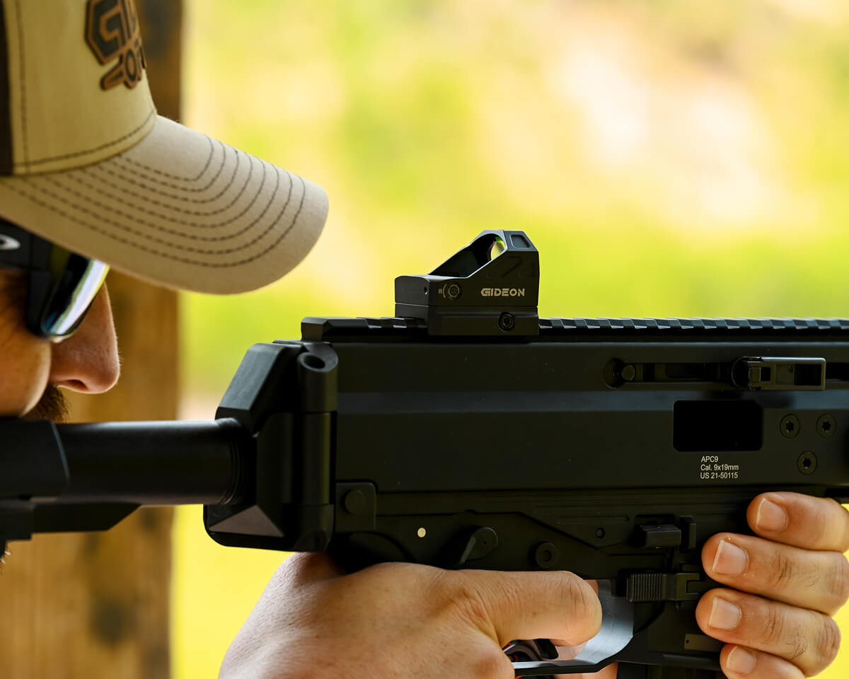 image-3 - Gideon Optics Man at a gun range shooting a firearm with a GIdeon Optics red dot sight attached