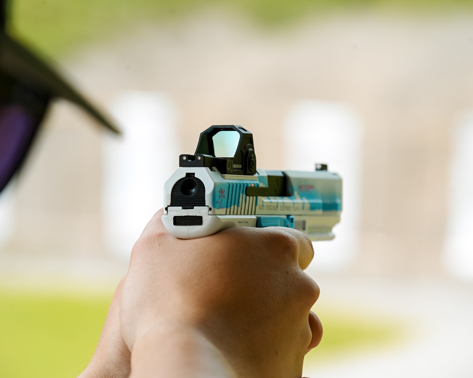 A shooter practices using a red dot sight