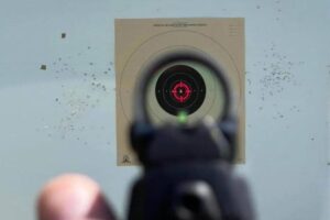 view of red dot reticle at outdoor driving range