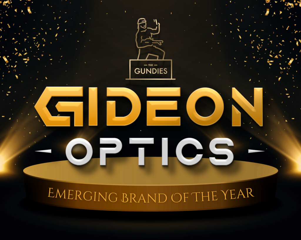 The Gundies Trophy above Gideon Optics logo on a gold state with lights shining towards the logo