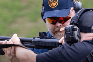 Mike from Gideon Optics giving guidance to a shooter while theyre on an outdoor shooting range - Gideon Optics Mike from Gideon Optics giving guidance to a shooter while theyre on an outdoor shooting range
