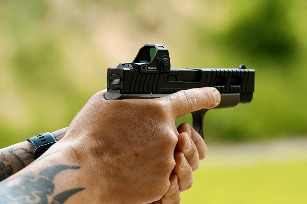 pistol grip - Gideon Optics Hands gripping a pistol with a Gideon Optics red dot mounted
